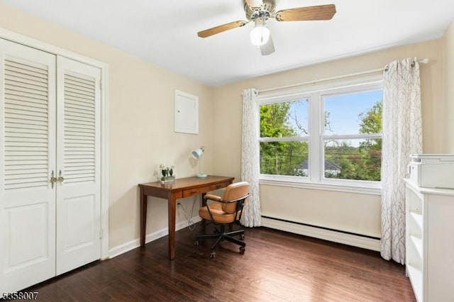 home office with a baseboard heating unit, wood finished floors, ceiling fan, and baseboards
