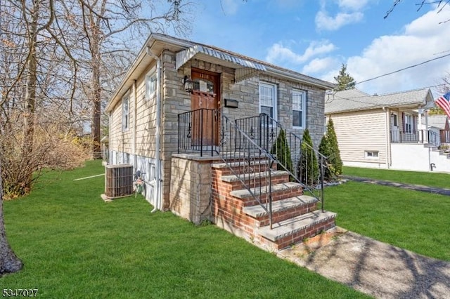 1218 Kline Pl, Rahway City, NJ 07065 - view of front of home with stone siding, a front lawn, and central AC