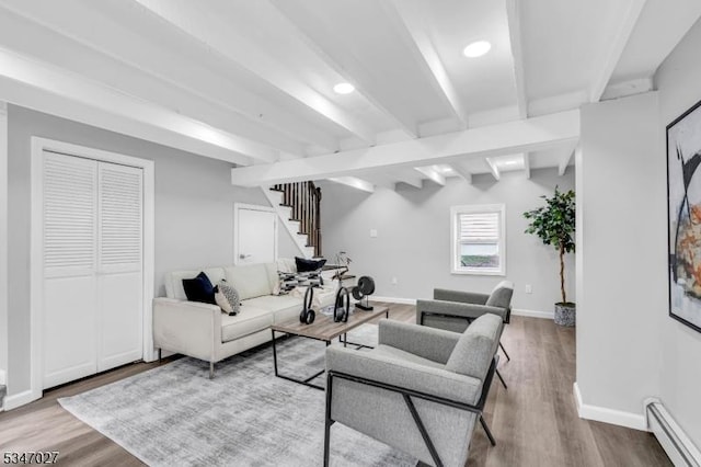 1218 Kline Pl, Rahway City, NJ 07065 - living room featuring a baseboard heating unit, beam ceiling, stairs, wood finished floors, and baseboards