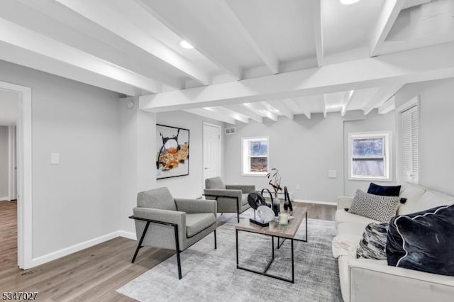 1218 Kline Pl, Rahway City, NJ 07065 - living area with light wood finished floors, beam ceiling, and baseboards