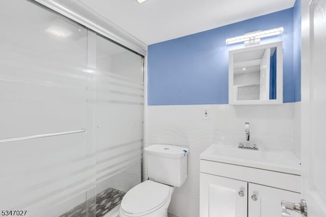 1218 Kline Pl, Rahway City, NJ 07065 - bathroom with vanity, toilet, a shower stall, and tile walls