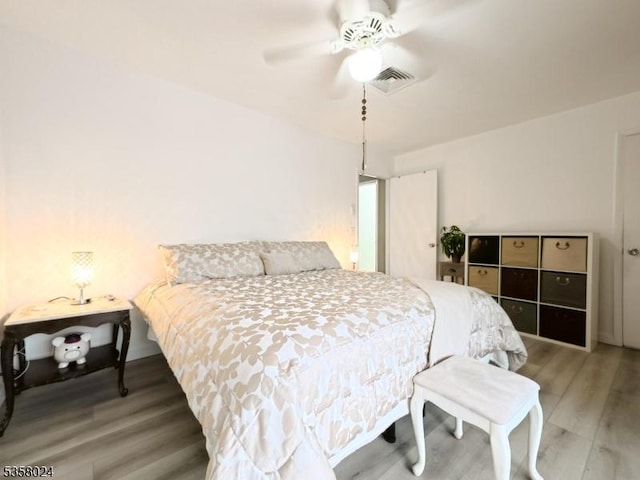 bedroom featuring wood finished floors and a ceiling fan