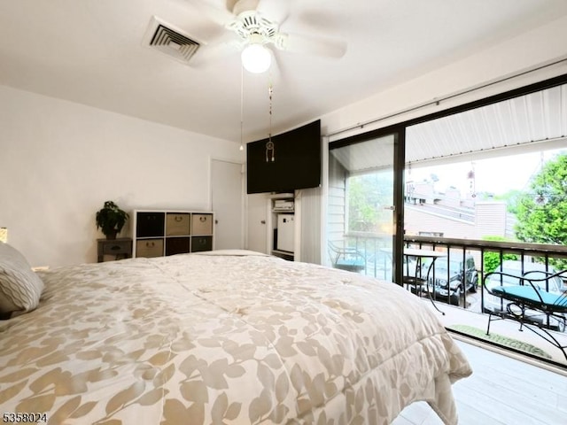 bedroom featuring multiple windows and access to outside