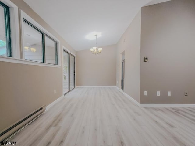 empty room with baseboard heating, a chandelier, light wood-style floors, vaulted ceiling, and baseboards
