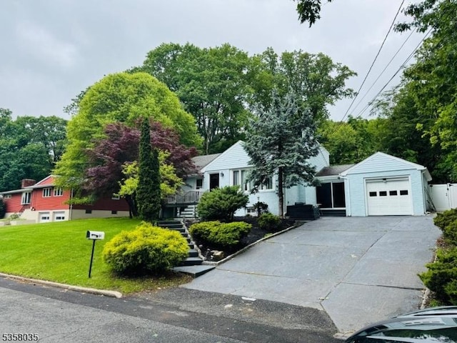 64 Dater St, North Haledon Boro, NJ 07508 - view of front facade featuring a front lawn, a garage, stairs, and driveway