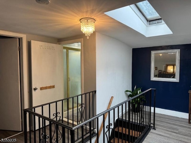 64 Dater St, North Haledon Boro, NJ 07508 - stairs with a skylight, a chandelier, and baseboards