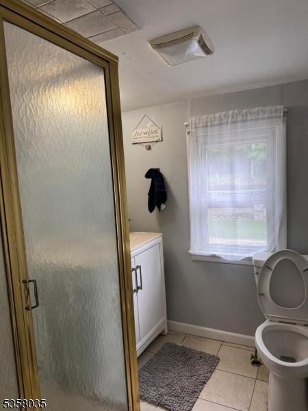 64 Dater St, North Haledon Boro, NJ 07508 - full bath with tile patterned floors, a stall shower, toilet, baseboards, and vanity