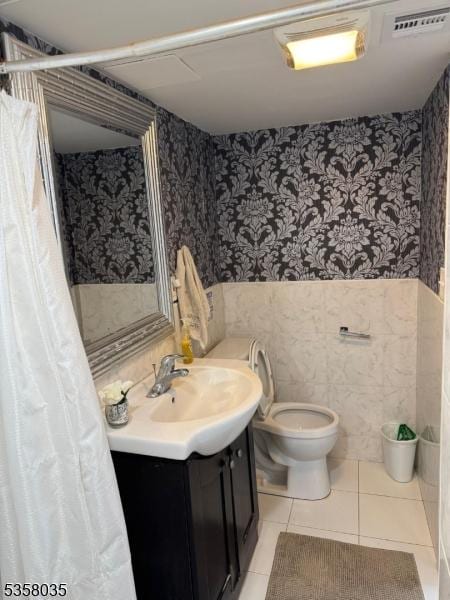 64 Dater St, North Haledon Boro, NJ 07508 - bathroom featuring wallpapered walls, wainscoting, vanity, toilet, and tile patterned floors