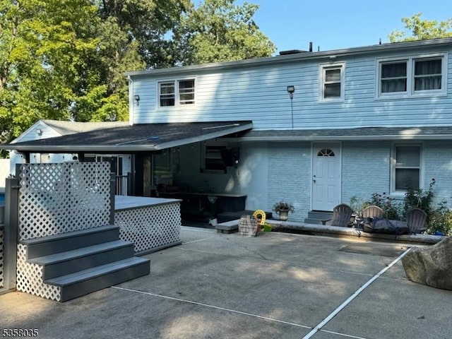 64 Dater St, North Haledon Boro, NJ 07508 - rear view of house featuring a patio and brick siding