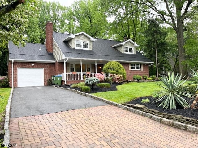 95 Union Ave, Edison Twp, NJ 08820 - cape cod home with brick siding, a porch, a chimney, and an attached garage