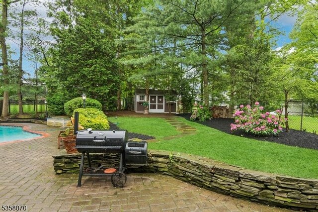 95 Union Ave, Edison Twp, NJ 08820 - view of yard featuring a patio area, an outdoor structure, and a storage shed
