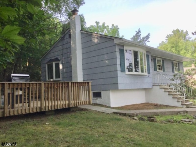 78 Hillside Ter, Green Twp, NJ 07821 - view of home's exterior featuring a chimney and a wooden deck