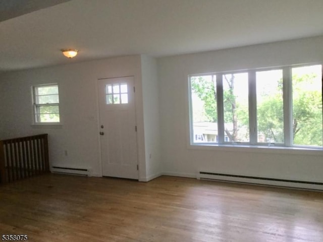 78 Hillside Ter, Green Twp, NJ 07821 - entrance foyer featuring baseboard heating, wood finished floors, and baseboards