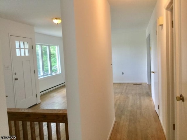 78 Hillside Ter, Green Twp, NJ 07821 - hall with baseboard heating, wood finished floors, and baseboards