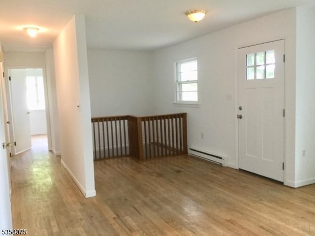78 Hillside Ter, Green Twp, NJ 07821 - foyer with a baseboard heating unit, wood finished floors, and baseboards
