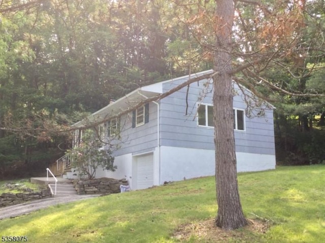 78 Hillside Ter, Green Twp, NJ 07821 - view of side of home featuring a lawn, stairway, and an attached garage