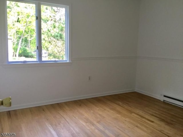 78 Hillside Ter, Green Twp, NJ 07821 - unfurnished room with light wood finished floors, healthy amount of natural light, and baseboards