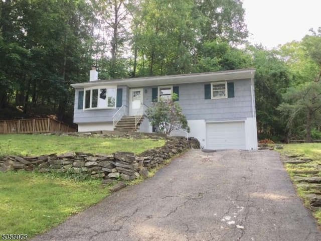 78 Hillside Ter, Green Twp, NJ 07821 - ranch-style house with a garage, driveway, a chimney, and a front yard