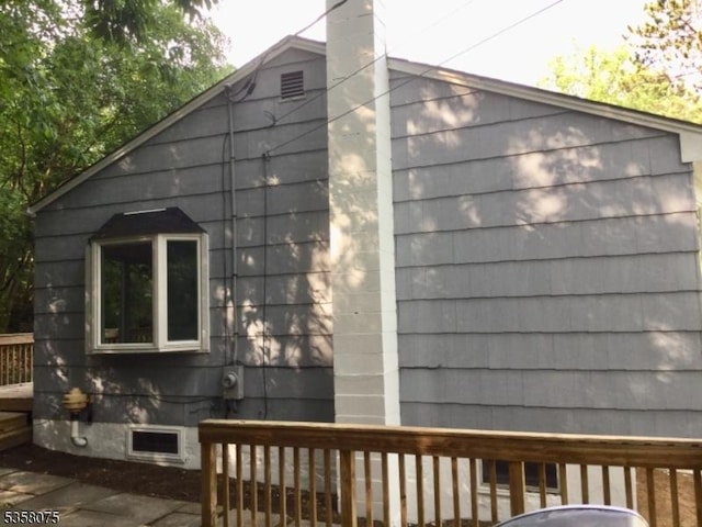 78 Hillside Ter, Green Twp, NJ 07821 - view of side of property with a wooden deck and a chimney
