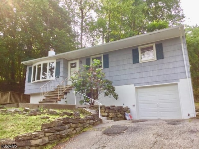 78 Hillside Ter, Green Twp, NJ 07821 - ranch-style home with a chimney and an attached garage