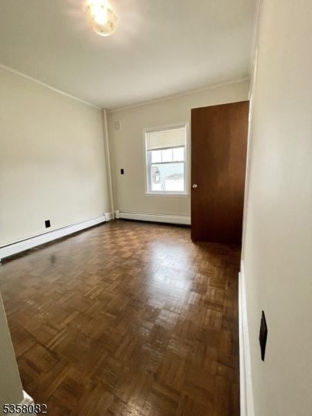 277 Watchung Ave, North Plainfield Boro, NJ 07060 - spare room with a baseboard heating unit and crown molding
