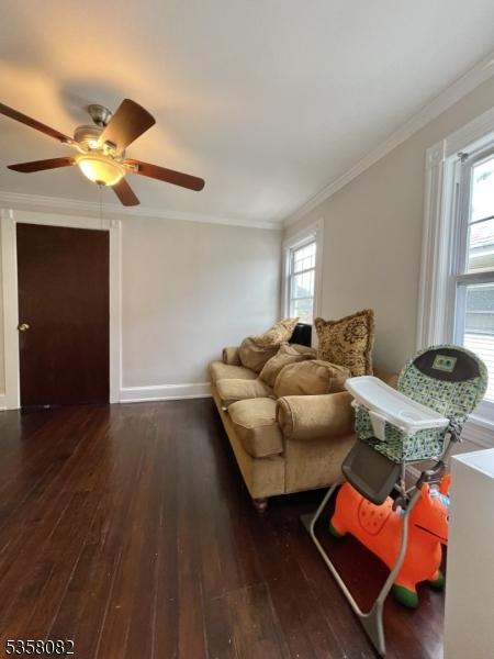 277 Watchung Ave, North Plainfield Boro, NJ 07060 - living room featuring hardwood / wood-style floors, ornamental molding, healthy amount of natural light, and a ceiling fan