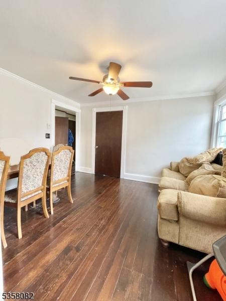 277 Watchung Ave, North Plainfield Boro, NJ 07060 - living area featuring ceiling fan, crown molding, wood-type flooring, and baseboards