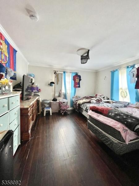 277 Watchung Ave, North Plainfield Boro, NJ 07060 - bedroom featuring dark wood finished floors and crown molding
