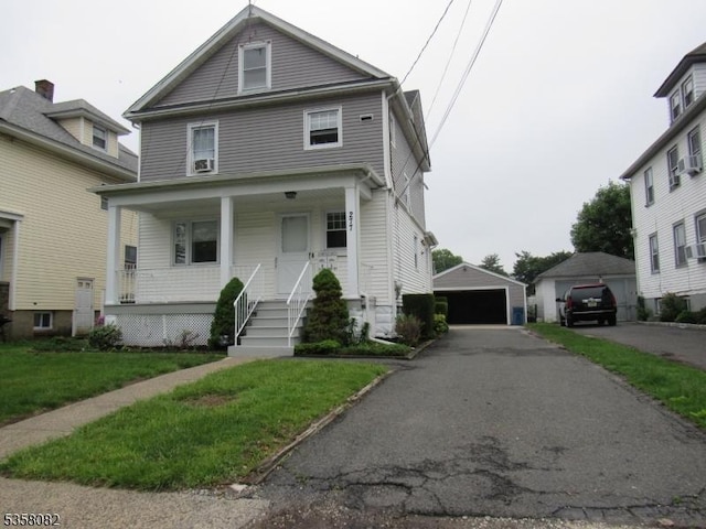 277 Watchung Ave, North Plainfield Boro, NJ 07060 - traditional style home with covered porch, a detached garage, an outbuilding, and a front yard