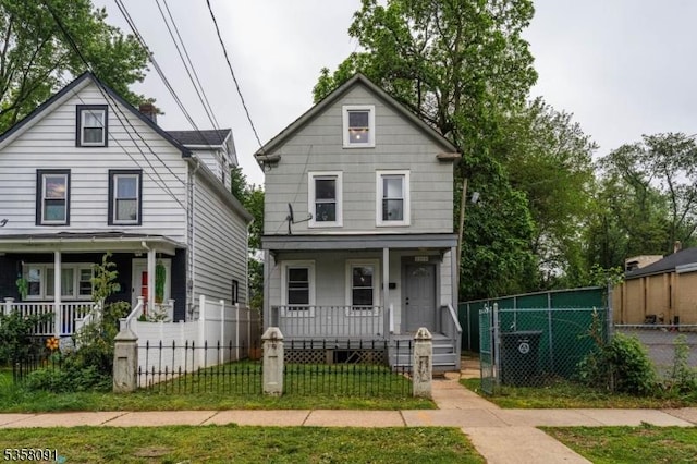1353 W 3rd St, Plainfield City, NJ 07063 - traditional style home featuring a porch and a fenced front yard