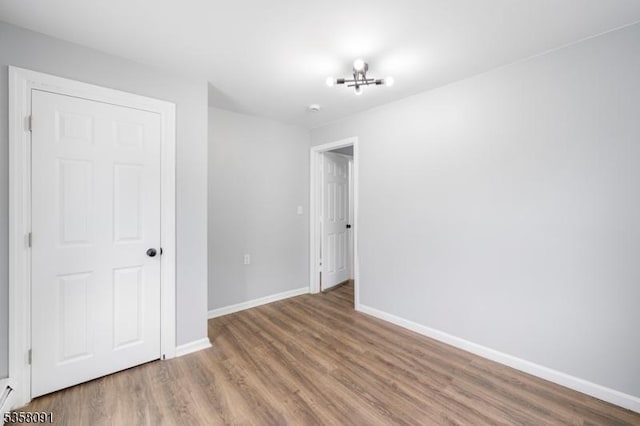 1353 W 3rd St, Plainfield City, NJ 07063 - unfurnished bedroom featuring wood finished floors and baseboards