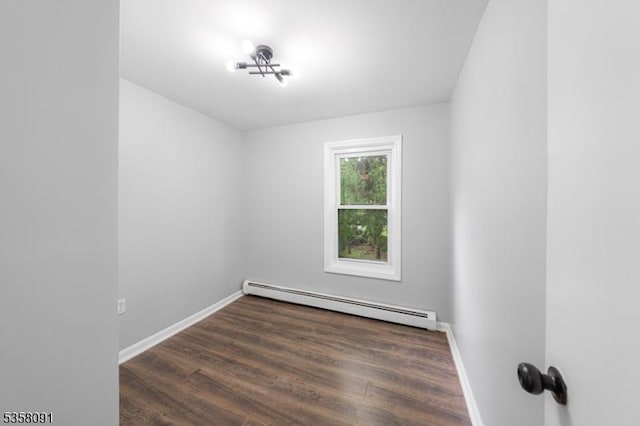 1353 W 3rd St, Plainfield City, NJ 07063 - spare room with a baseboard heating unit, baseboards, and wood finished floors