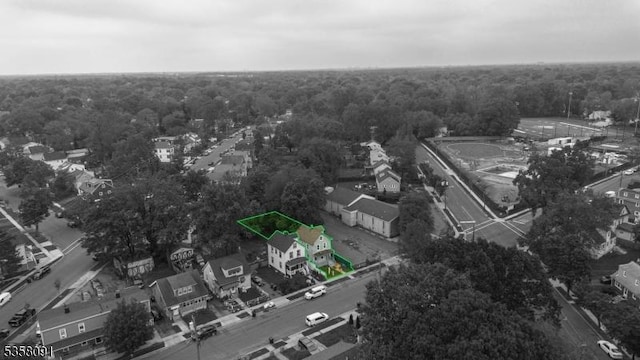 1353 W 3rd St, Plainfield City, NJ 07063 - aerial view of property and surrounding area with property boundaries highlighted and a heavily wooded area