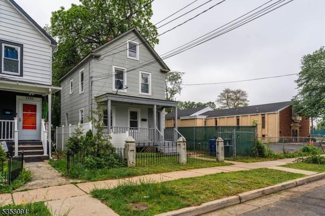 1353 W 3rd St, Plainfield City, NJ 07063 - view of front facade featuring a porch and a fenced front yard