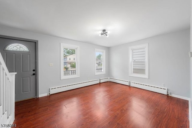 1353 W 3rd St, Plainfield City, NJ 07063 - foyer featuring baseboard heating, wood finished floors, baseboards, and stairs