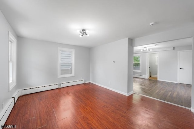 1353 W 3rd St, Plainfield City, NJ 07063 - empty room featuring baseboard heating, wood finished floors, and baseboards