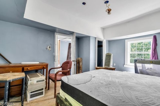 bedroom with light colored carpet
