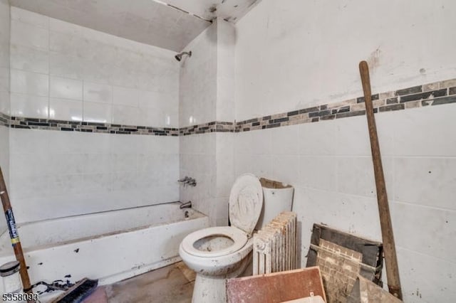full bath featuring shower / bathtub combination, toilet, tile walls, and unfinished concrete flooring