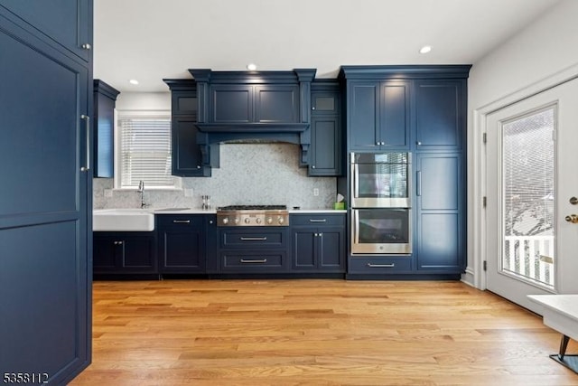 208 W Milton Ave, Rahway City, NJ 07065 - kitchen with stainless steel appliances, light countertops, tasteful backsplash, recessed lighting, and blue cabinets