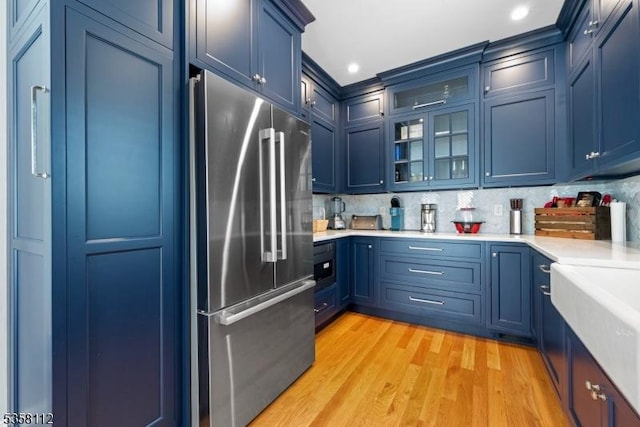 208 W Milton Ave, Rahway City, NJ 07065 - kitchen with high end refrigerator, blue cabinets, light wood-type flooring, light countertops, and recessed lighting