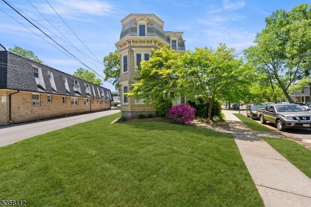 208 W Milton Ave, Rahway City, NJ 07065 - view of front facade featuring a front yard
