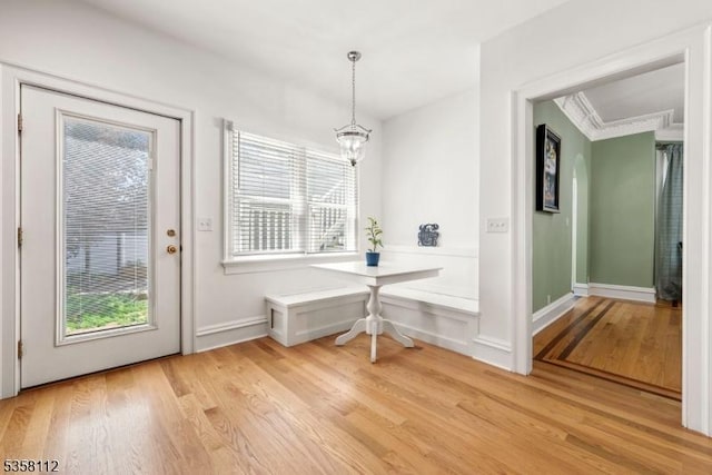 208 W Milton Ave, Rahway City, NJ 07065 - dining space featuring light wood finished floors, healthy amount of natural light, a chandelier, and baseboards