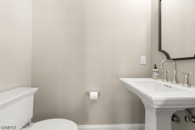 208 W Milton Ave, Rahway City, NJ 07065 - bathroom featuring toilet and a sink