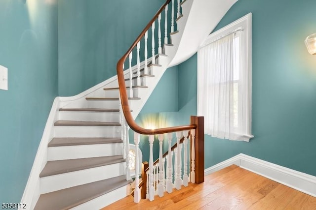 208 W Milton Ave, Rahway City, NJ 07065 - staircase with wood finished floors and baseboards