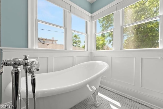 208 W Milton Ave, Rahway City, NJ 07065 - bathroom featuring a decorative wall, plenty of natural light, and a freestanding tub