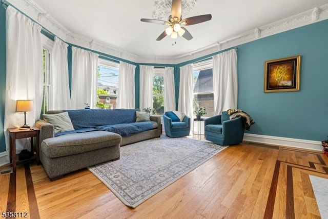 208 W Milton Ave, Rahway City, NJ 07065 - living area featuring baseboards, a ceiling fan, crown molding, and light wood-type flooring