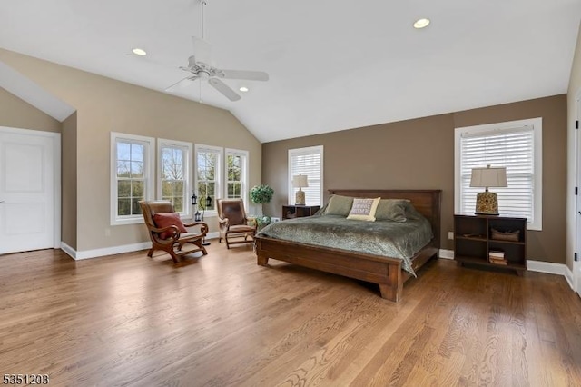 bedroom featuring vaulted ceiling, wood finished floors, baseboards, recessed lighting, and a ceiling fan