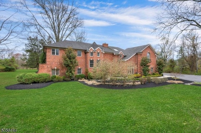 2250 Lamington Rd, Bedminster Twp, NJ 07921 - view of front of house featuring brick siding, a chimney, and a front lawn
