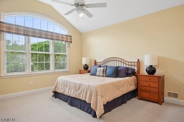 carpeted bedroom with vaulted ceiling, baseboards, and a ceiling fan