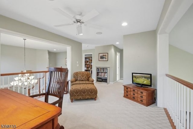 living area with a chandelier, carpet floors, ceiling fan, and recessed lighting